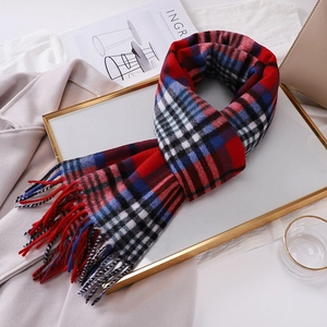 Detailed view of 100% Australian wool plaid scarf with fringes and cozy winter texture