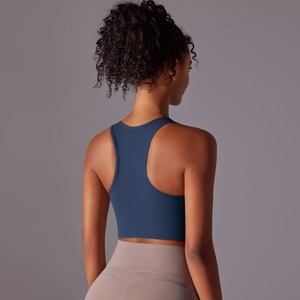 Detailed back view of a navy racerback sports bra with high-support seamless fabric