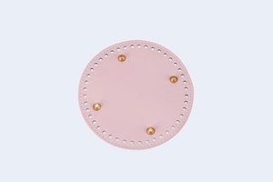 Pink round PU leather bag base with pre-punched holes and four gold metal feet for DIY