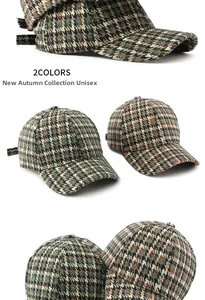 Detail of classic houndstooth baseball cap in green and brown patterns for unisex wear