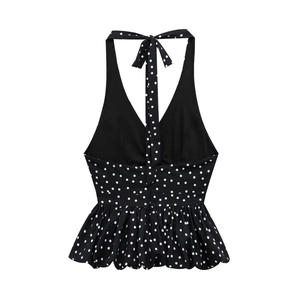 Polka dot halter neck backless top with ruffled hem and tie-up design in black and white