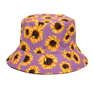 Close-up of vibrant purple bucket hat with bright yellow sunflower prints and twill fabric