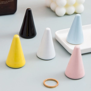 Minimalist ceramic cone ring stands in multiple pastel colors for jewelry display
