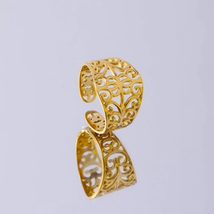 Golden stainless steel mesh ring with ornate scroll patterns and adjustable open design