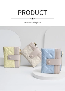 Close-up of quilted PU leather mini wallets in yellow, beige and blue with metal zippers
