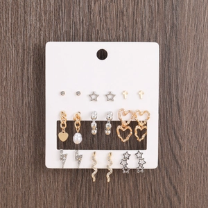 Set of 9 pairs of gold and silver earrings with crosses hearts and rhinestones on card