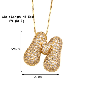 Detail showing dimensions of letter M gold pendant necklace with cubic zirconia stones