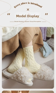 Detail of yellow thick cable knit socks paired with plush white slippers for winter warmth