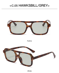 Detail view of tortoiseshell double-bridge sunglasses with grey lenses and C.05 marking