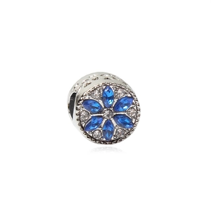 Silver flower charm with blue and white crystals for DIY bracelets on white background