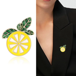 Cute yellow lemon drip glaze brooch for women shown as product closeup and on clothing