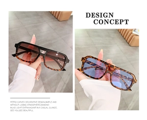 Detail of square oversized sunglasses with tortoise shell frames and gradient lenses