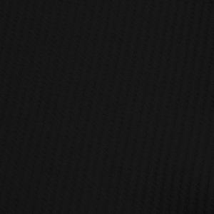 Close-up of black waffle knit fabric texture on men polo shirt showing detailed honeycomb weave