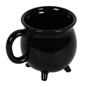 Detailed view of the shiny black ceramic cauldron mug with unique tripod feet and handle