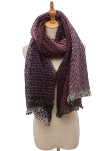 Detailed view of the dark red and blue knit scarf featuring a soft tassel design