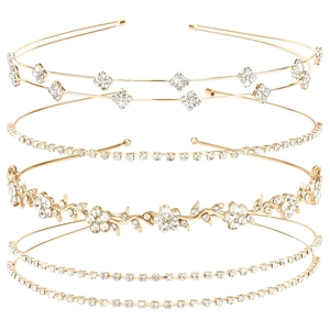 Detailed set of four golden bridal headbands with rhinestones and floral patterns