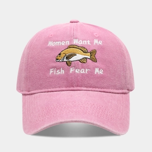 Close-up of pink washed cotton baseball cap with Women Want Me Fish Fear Me embroidery