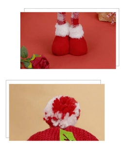 Detail of Christmas gnome with red checkered legs, felt boots and soft plush pompom decoration