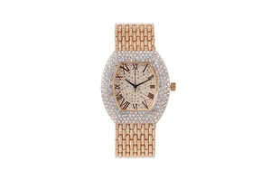 Detailed close-up of a tonneau-shaped rose gold women's watch with shimmering crystals