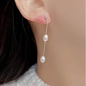 Detail of s925 silver long fringe earrings with natural freshwater double pearls