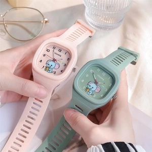 Detail showing two cute square watches with cartoon elephant dials and soft silicone straps