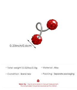 Macro shot of silver alloy screw earrings featuring dual red crystal pave round balls