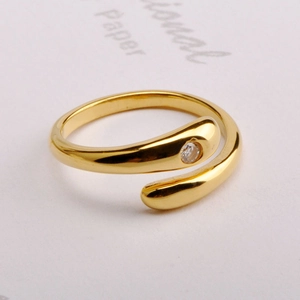 Minimalist 18K gold snake-shaped open ring with a sparkling cubic zirconia stone