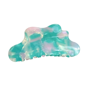 Cloud-shaped marble acetic acid hair claw clip with pearlescent finish on white background