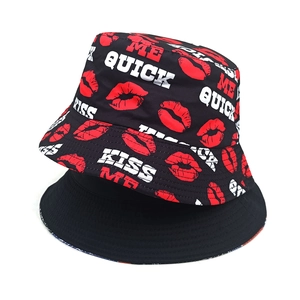 Double-sided bucket hat with red lip prints and Kiss Me Quick letters for outdoor sun protection