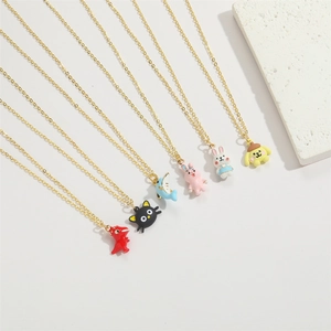 Golden necklaces with colorful enamel animal pendants including dinosaur, cat and rabbit