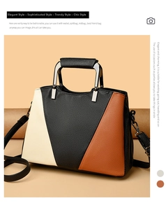 Detail of color-block tote bag with lychee texture and silver metal handle
