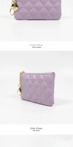 Detail view of purple quilted PU leather coin purse with golden zipper and logo charm