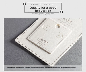 Detail of white textured jewelry display card with Silver S925 and Handmade branding