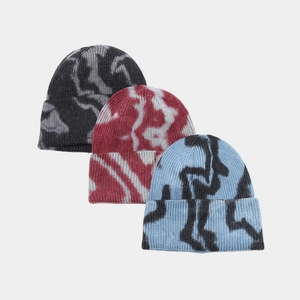 Three-piece tie-dye knit beanie set for women featuring abstract patterns in street style