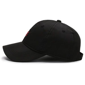 Lightweight black baseball cap with honeycomb mesh texture and red side stripes