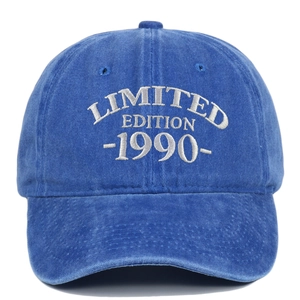 Detail of white embroidery with LIMITED EDITION 1990 on navy blue washed cotton cap