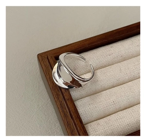 Detailed macro view of S925 sterling silver saddle ring with irregular wavy texture
