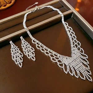 Macro view of crystal rhinestones on elegant silver plated necklace and earrings set