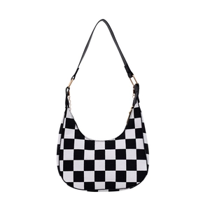 Retro black and white checkerboard crescent shoulder bag with golden hardware