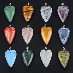 Collection of twelve natural crystal and agate heart-shaped pendants in a 3x4 matrix layout