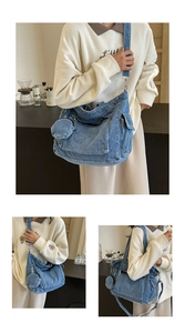 Detail of blue denim tote bag with wide strap and matching round coin purse pendant