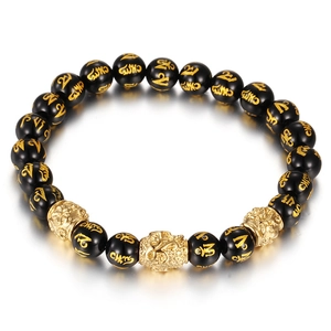 Bracelet ethnique en onyx noir avec tête de bouddha dorée et perles gravées du mantra