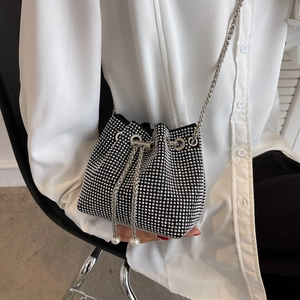 Chic black bucket bag with silver rhinestones, drawstring closure and chain strap