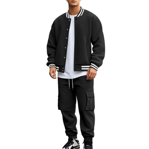 Detail of black fleece-lined baseball jacket with striped collar and cargo pants pocket