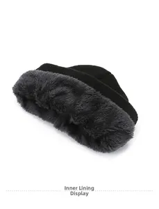 Detail view of the thick gray plush lining inside the black knitted winter beanie