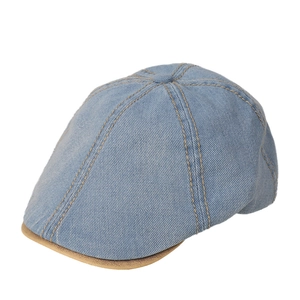 Classic navy denim newsboy cap with khaki trim contrast and vintage stitching details