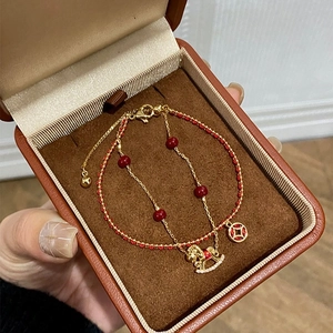 Luxury 18k gold-plated bracelet with red beads and zircon horse charm in a premium gift box