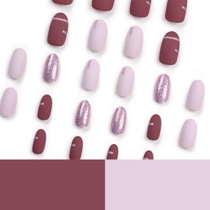 Short round press-on nails in burgundy and pink glitter finish for a minimalist style