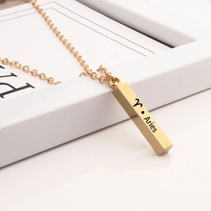 Minimalist gold Aries zodiac cylinder pendant necklace with engraved sign and chain