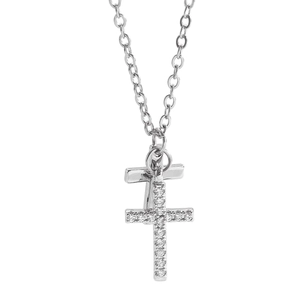 Close-up of silver double cross pendant necklace with cubic zirconia micro-pave setting